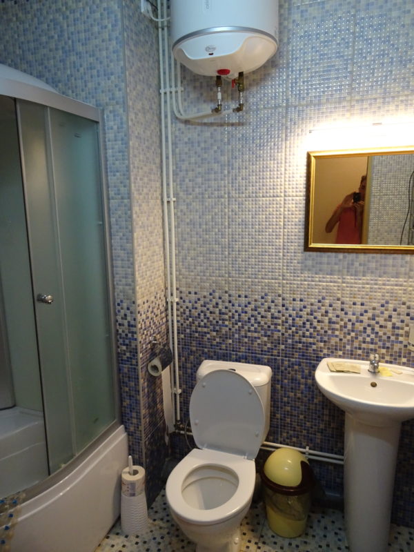 Bathroom with toilet, shower, sink