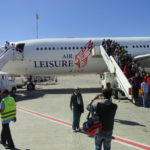 Airplane with people on stairs