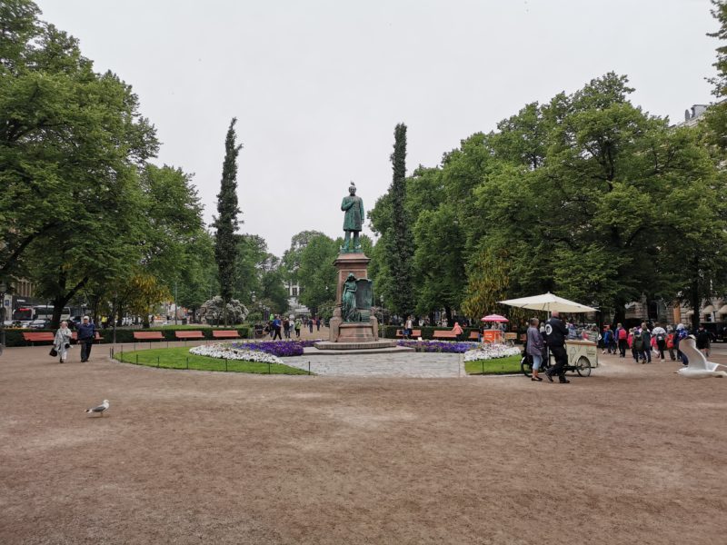 Park with statue, fountain, people