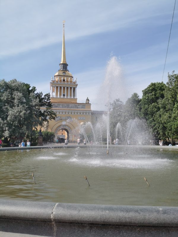 Building with spire and fountain