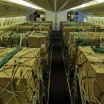 Aircraft cabin full of boxes