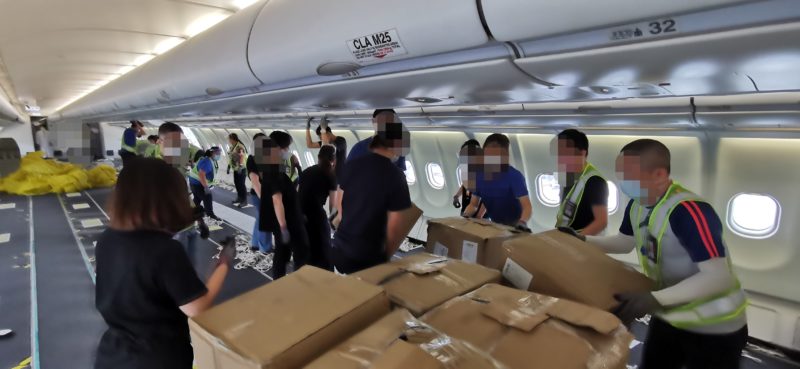Boxes stacked in aircraft cabin