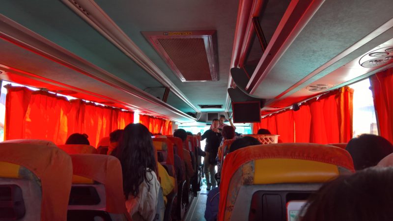 Interior of bus with red curtains