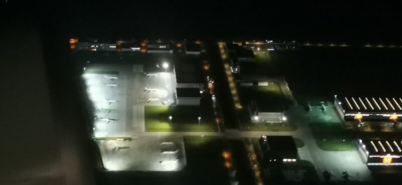 Aircraft on parking apron at night